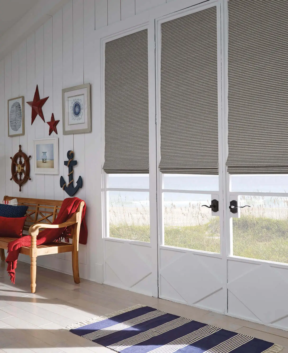 Natural shades covering windows in a cozy, sunlit room.