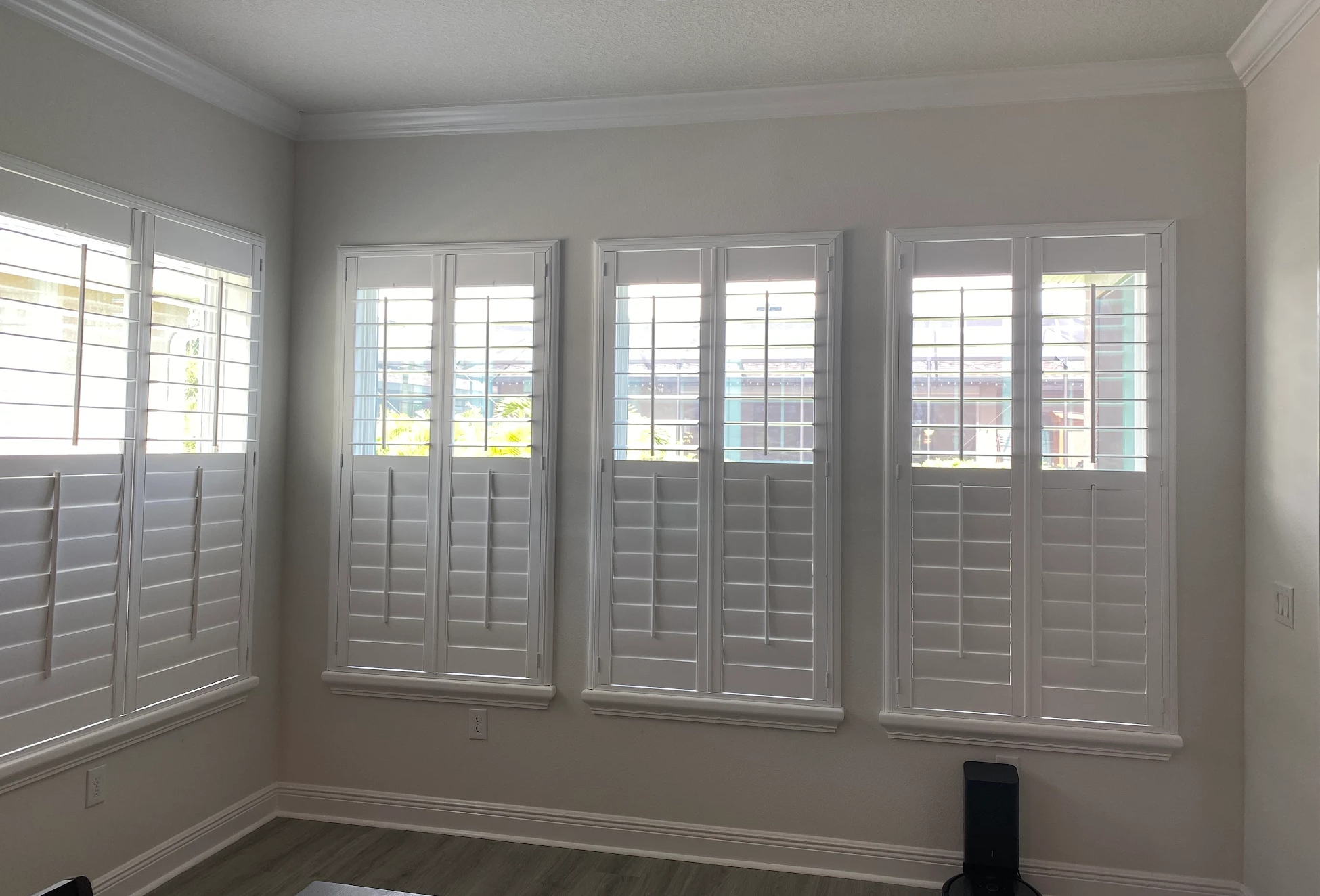 White plantation shutters with tilt bar